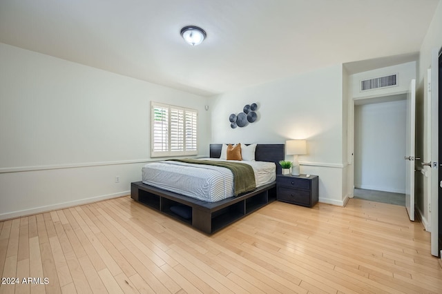 bedroom with light hardwood / wood-style flooring