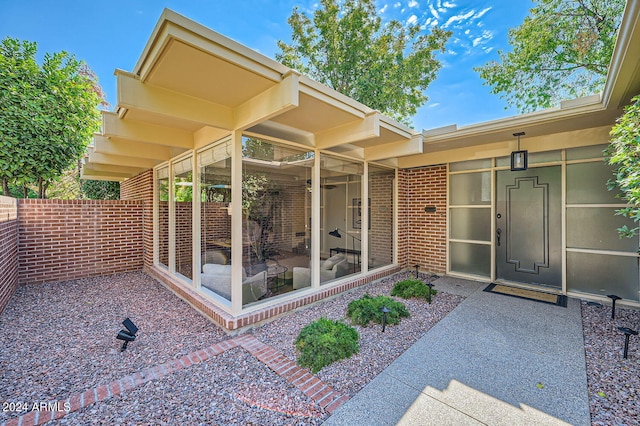 entrance to property with a patio area