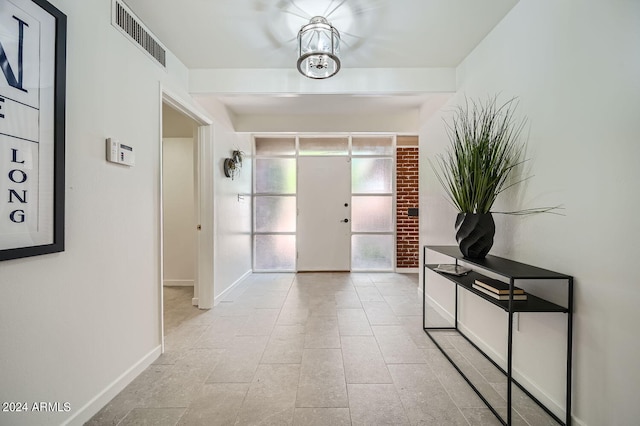 entrance foyer with a notable chandelier