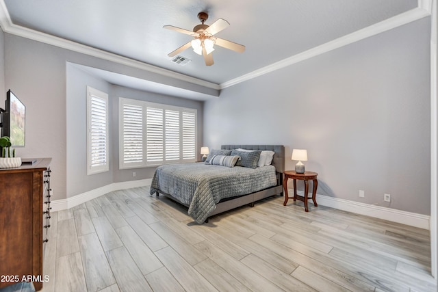 bedroom featuring ornamental molding, light wood-style floors, baseboards, and ceiling fan