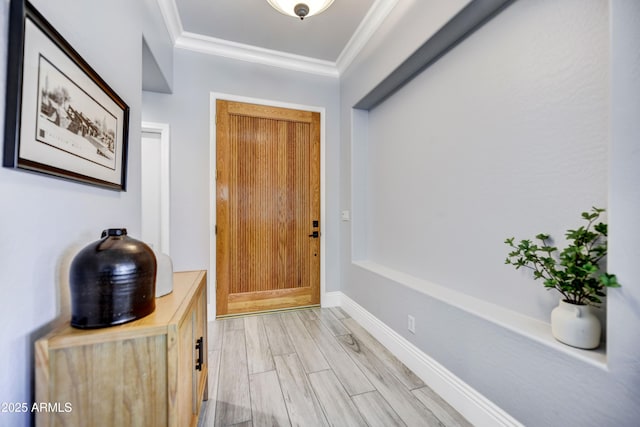 entryway featuring ornamental molding and light wood-type flooring