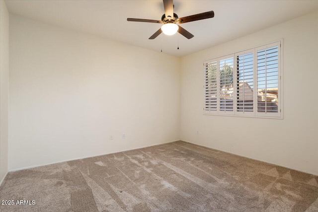 carpeted empty room with ceiling fan