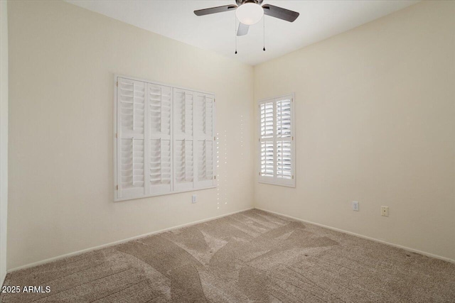 carpeted empty room with ceiling fan