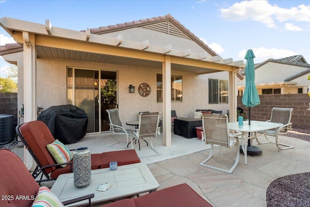 back of house with central AC unit and a patio area