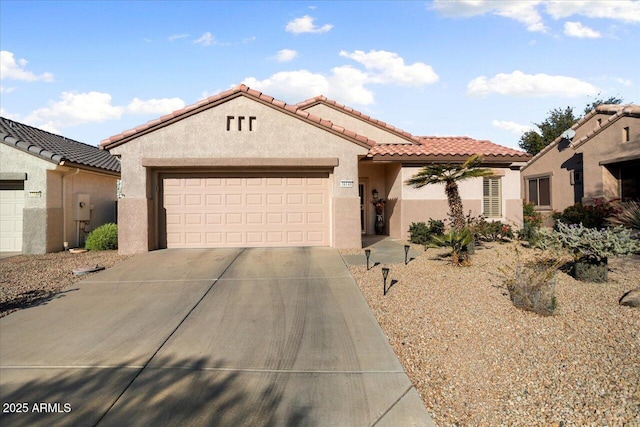 mediterranean / spanish-style house featuring a garage