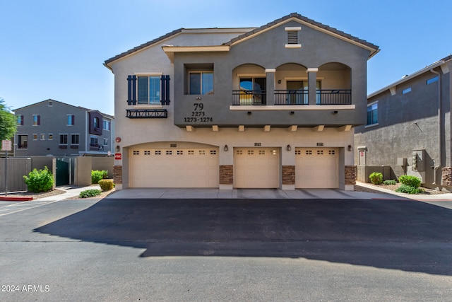 view of front of house with a balcony and a garage