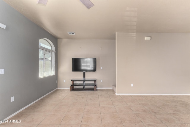 unfurnished living room with light tile patterned floors