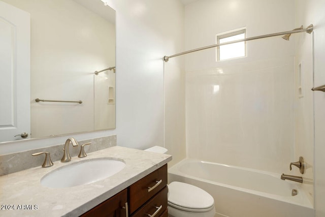 full bathroom with tub / shower combination, vanity, and toilet