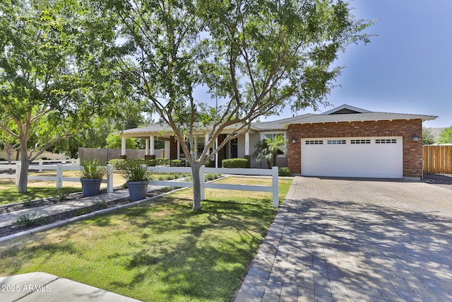 1505 W Orangewood Ave W, Phoenix, AZ 85021 - ranch-style home featuring a garage, driveway, and brick siding