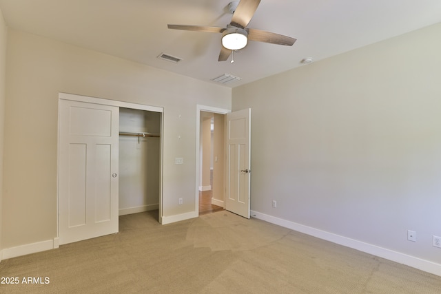 1505 W Orangewood Ave W, Phoenix, AZ 85021 - unfurnished bedroom featuring light carpet, a closet, and a ceiling fan