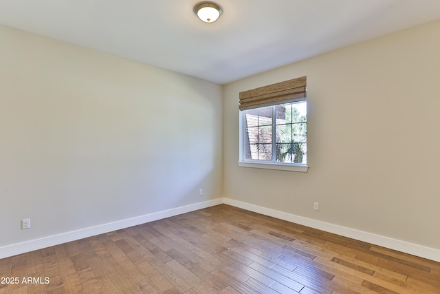 1505 W Orangewood Ave W, Phoenix, AZ 85021 - unfurnished room featuring hardwood / wood-style floors