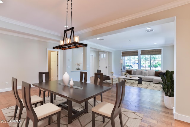 1505 W Orangewood Ave W, Phoenix, AZ 85021 - dining space featuring light wood finished floors, crown molding, recessed lighting, and a chandelier