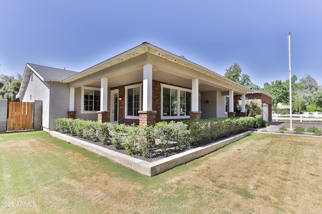 1505 W Orangewood Ave W, Phoenix, AZ 85021 - view of front facade with an attached garage, brick siding, a gate, stucco siding, and driveway