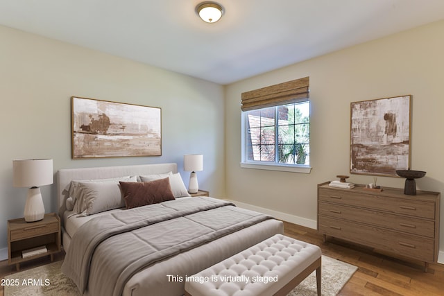 1505 W Orangewood Ave W, Phoenix, AZ 85021 - bedroom with baseboards and wood finished floors