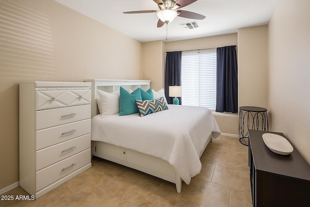 6610 E University Dr Unit 127, Mesa, AZ 85205 - bedroom with light tile patterned floors and a ceiling fan