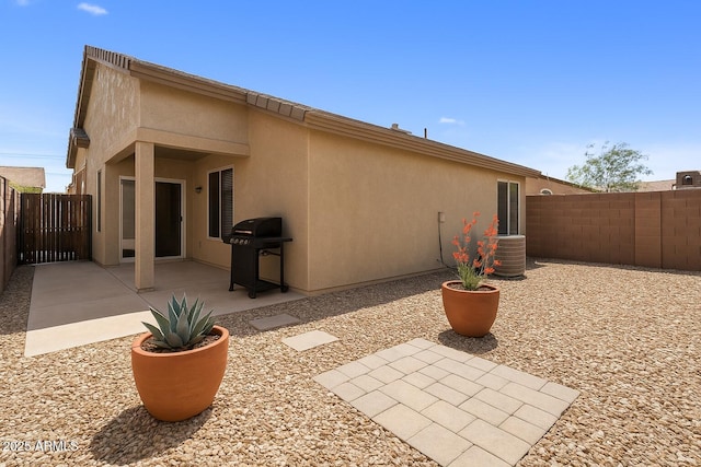 6610 E University Dr Unit 127, Mesa, AZ 85205 - back of house featuring a patio, stucco siding, and a fenced backyard