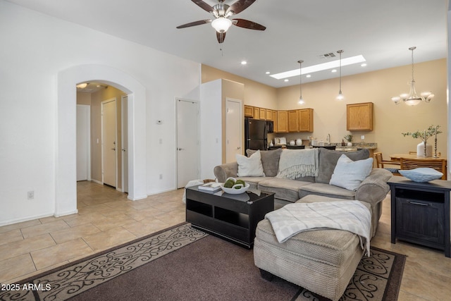 6610 E University Dr Unit 127, Mesa, AZ 85205 - living room featuring ceiling fan, arched walkways, a chandelier, recessed lighting, and light tile patterned flooring