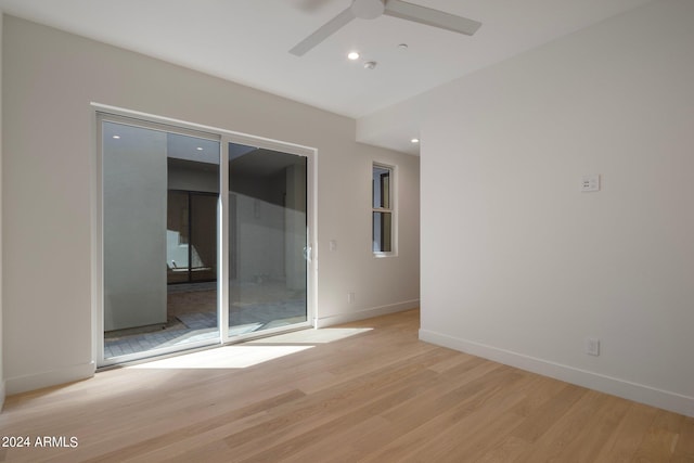 spare room with light hardwood / wood-style floors and ceiling fan