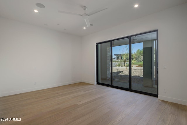 empty room featuring ceiling fan and light wood-type flooring