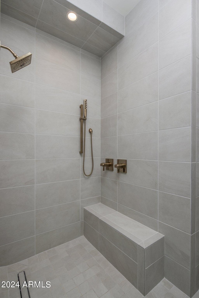 bathroom with a tile shower