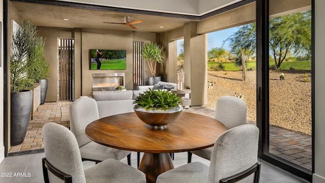 interior space with ceiling fan