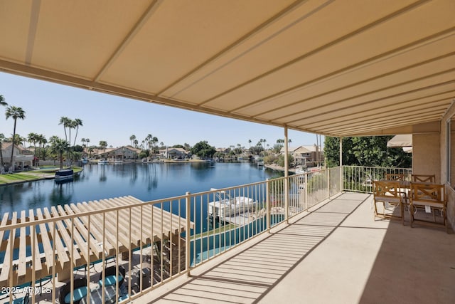 exterior space with a water view and a balcony