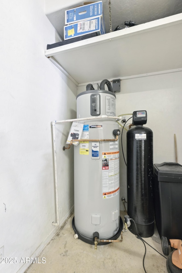 utility room featuring water heater