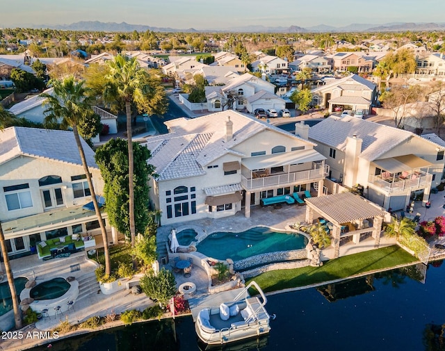 aerial view featuring a water view and a residential view