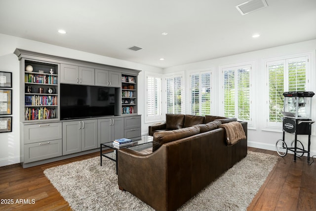 6556 N Arizona Biltmore Cir, Phoenix, AZ 85016 - living area with dark wood-type flooring, baseboards, and visible vents