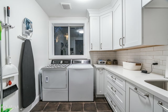 6556 N Arizona Biltmore Cir, Phoenix, AZ 85016 - laundry room with washing machine and dryer, visible vents, and cabinet space