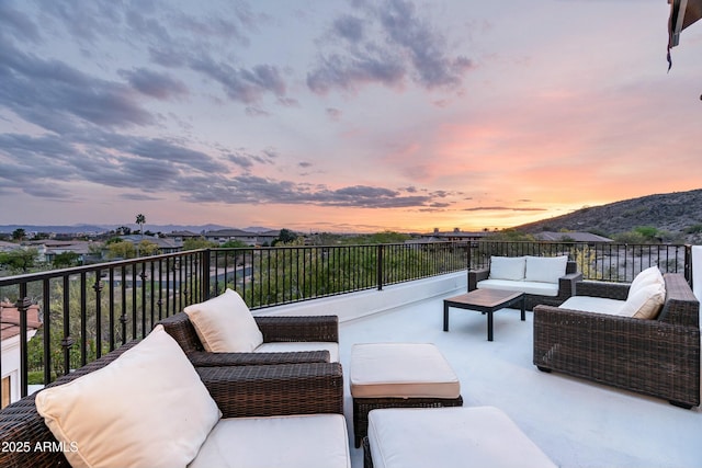 6556 N Arizona Biltmore Cir, Phoenix, AZ 85016 - patio terrace at dusk with a mountain view and outdoor lounge area