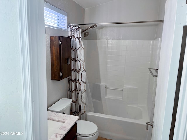 full bathroom with vanity, toilet, and shower / tub combo