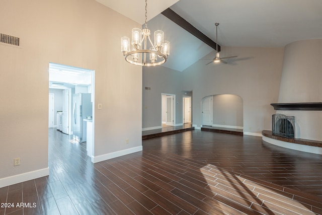 unfurnished living room with ceiling fan with notable chandelier, dark wood-type flooring, beam ceiling, high vaulted ceiling, and a fireplace