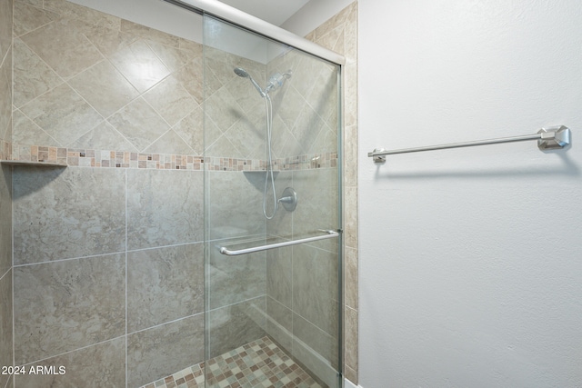 bathroom featuring an enclosed shower