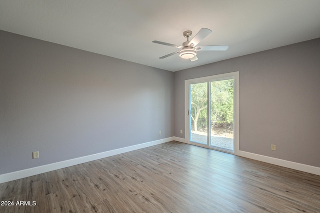 unfurnished room featuring light wood-type flooring and ceiling fan