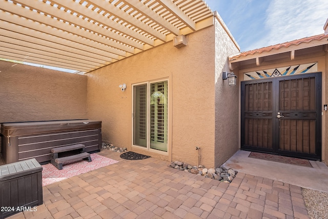 view of patio featuring a pergola and an AC wall unit