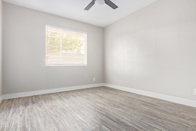 unfurnished room featuring ceiling fan and light hardwood / wood-style flooring