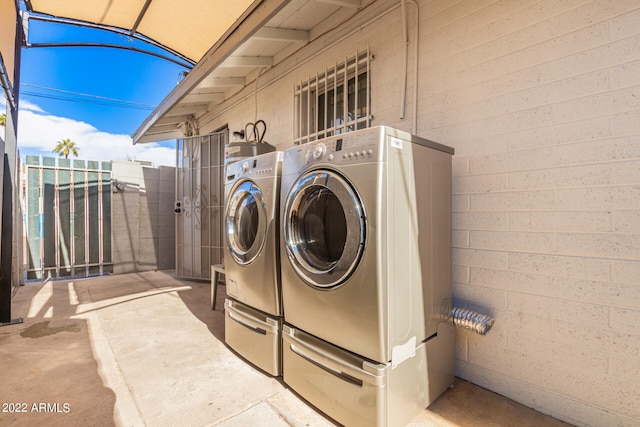 laundry area with separate washer and dryer