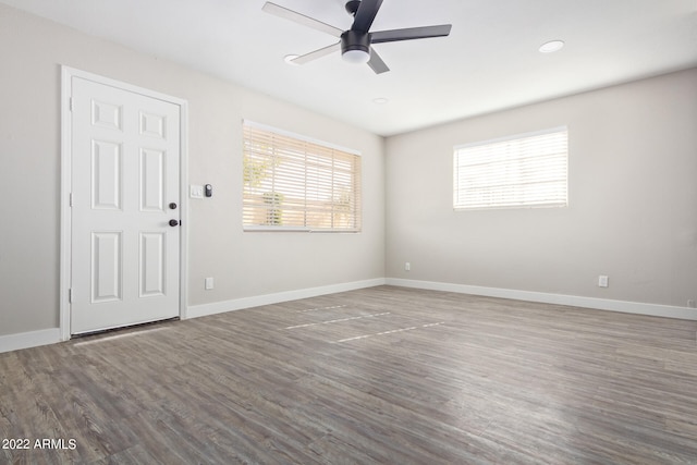 empty room featuring dark hardwood / wood-style floors and ceiling fan