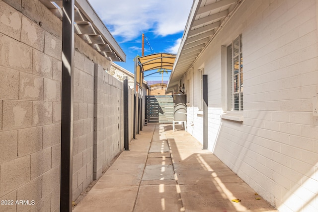 view of side of property with a patio