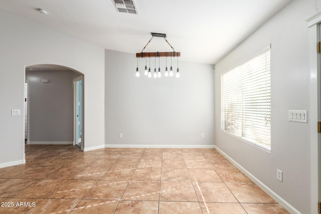 unfurnished room featuring light tile patterned floors