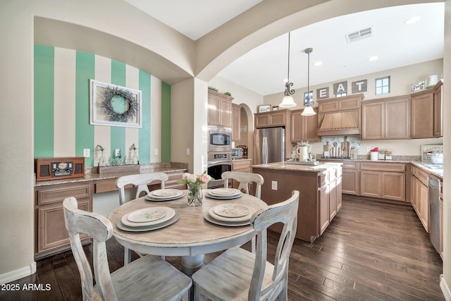 dining area featuring dark hardwood / wood-style floors