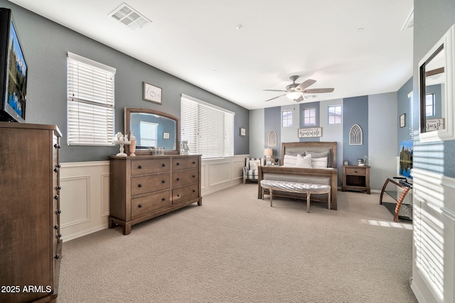 bedroom with light carpet and ceiling fan