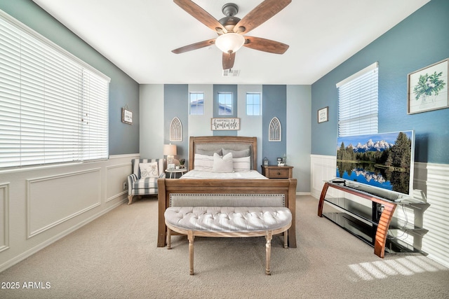 bedroom featuring ceiling fan and light colored carpet