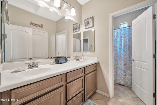 bathroom with a shower with shower curtain, tile patterned flooring, and vanity