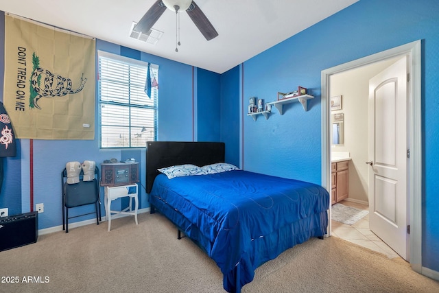 carpeted bedroom featuring ceiling fan and connected bathroom