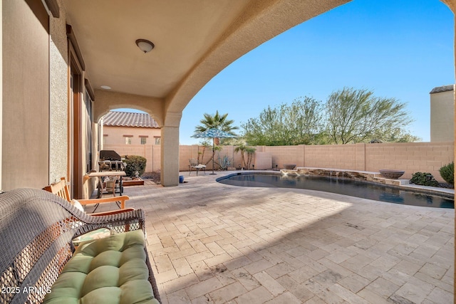 view of patio with a fenced in pool