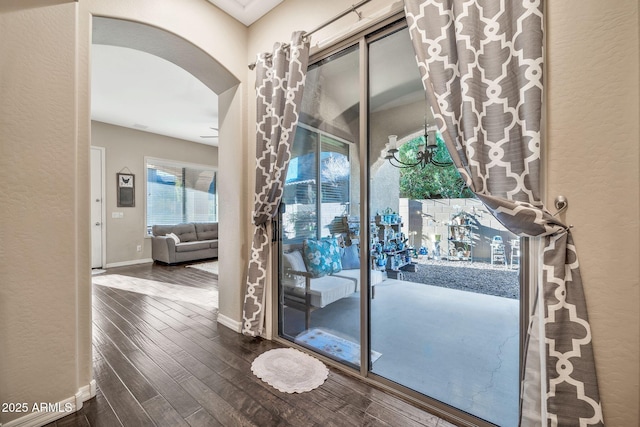 doorway to outside with dark hardwood / wood-style floors