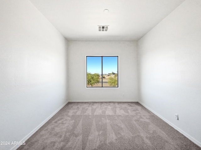 empty room with light colored carpet