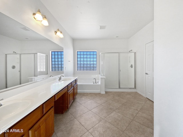 bathroom with vanity, tile patterned floors, and plus walk in shower